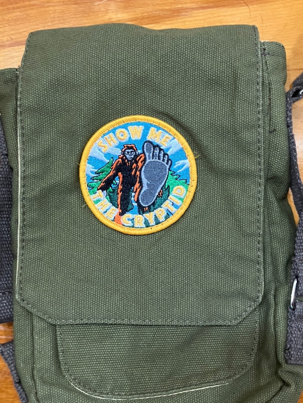 Canvas Crossbody Bag with 'Show Me the Cryptid' Patch - Olive Green
